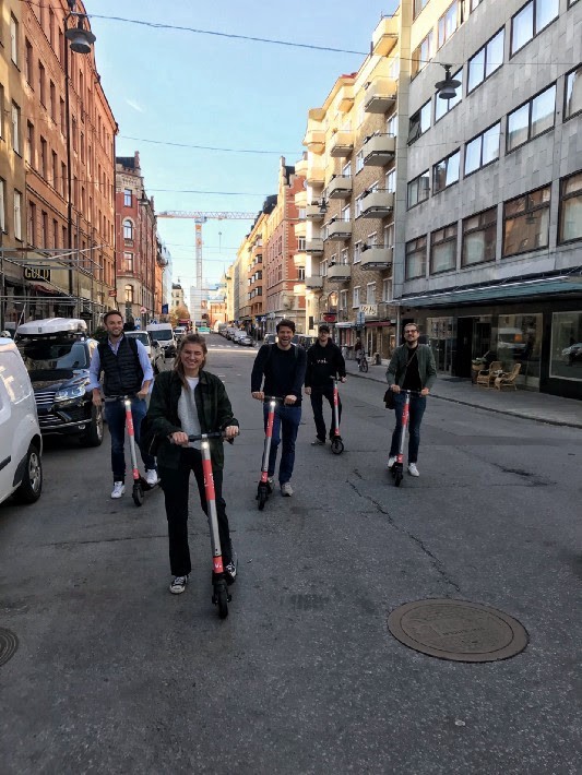 The Project A team in Stockholm, riding Voi e-scooters